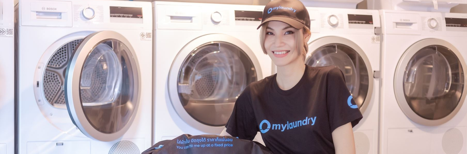 mylaundry staff member in front of our Bosch washing machines